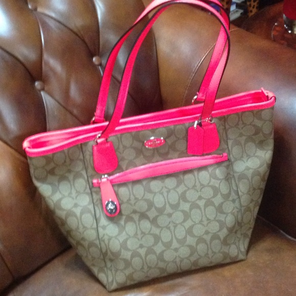 Coach handbag with pink neon trim