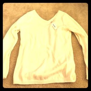 Cream v neck sweater.