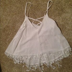 White top with fringe on bottom