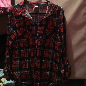 A long sleeve black, red and blue button up