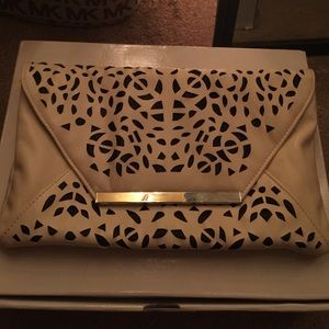 Beige and black cut out clutch
