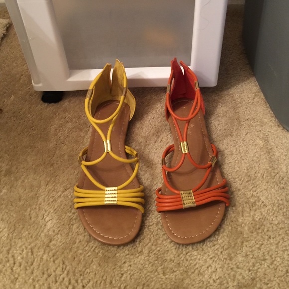 Orange pair of sandals and yellow pair