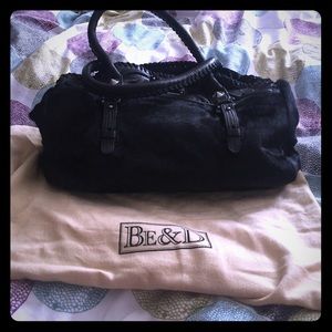 Natural leather and fur black purse.