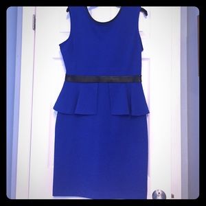Peplum sleeveless dress with banded waist.