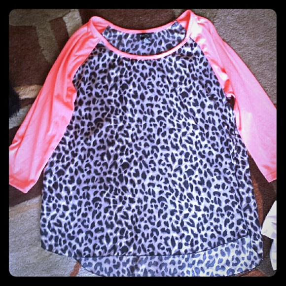 Peach and cheetah print shirt.