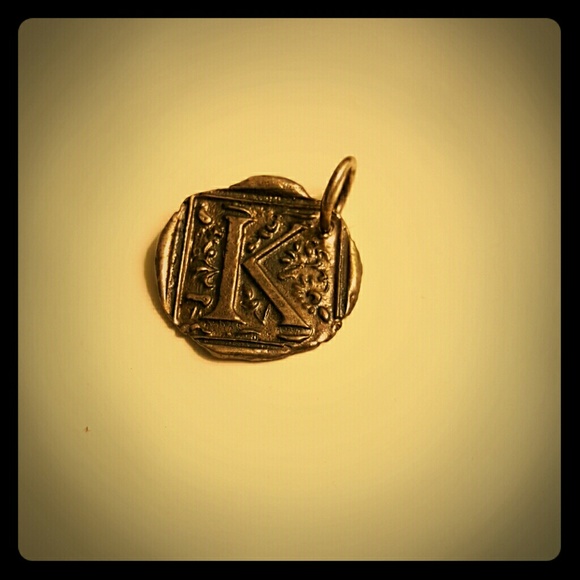 Waxing poetic "K" charm