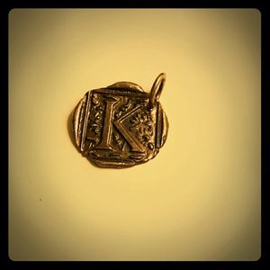 Waxing poetic "K" charm