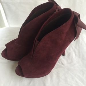 Vera Wang suede booties with back ribbon detail.