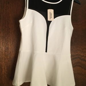 Black and white peplum top with mesh