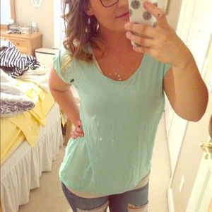 Casual t-shirt with sheer back. High-low cut