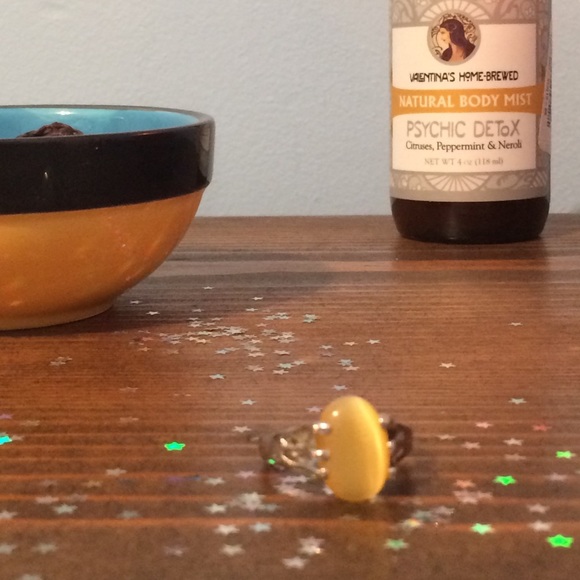 silver colored ring with yellow stone!