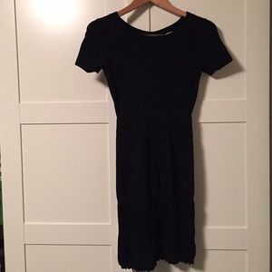 Fitted Black Sandro dress with pleated skirt