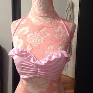 Pink and white bathing suit top. Never been worn.