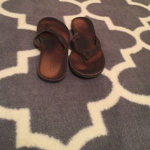 Brown leather flip flops