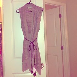 Sleeveless cardigan.