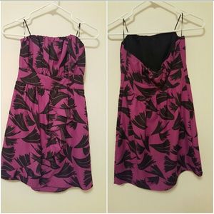 Purple strapless dress with ruffles on the side