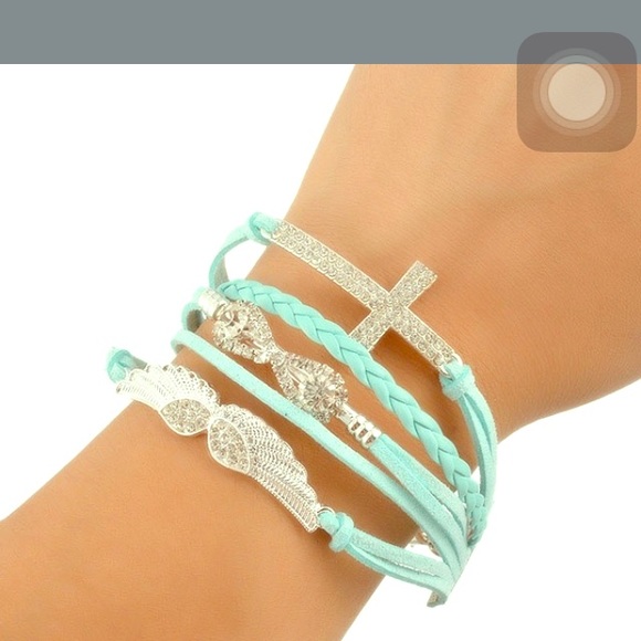 Light blue bling bracelet wings n cross  Blinged
