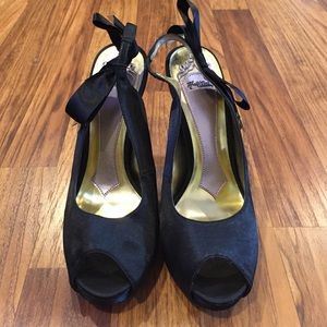 Black satin pumps