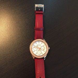 Rose Gold Fossil watch with removal leather bands.