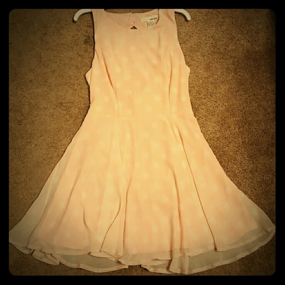 Pink dress with white polka-dots.