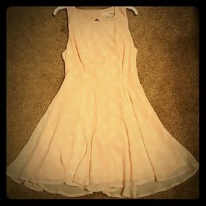 Pink dress with white polka-dots.