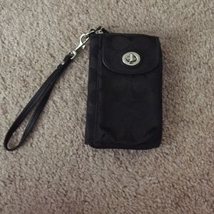 Coach clutch with cell phone holder