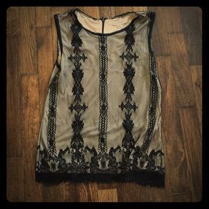 Sleeveless black and cream top