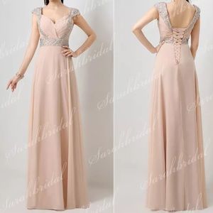 Chiffon peach-pink cap sleeve bridesmaid dress.