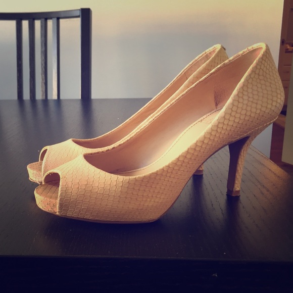 Vince Camino light pink snakeskin peeptoe pumps.