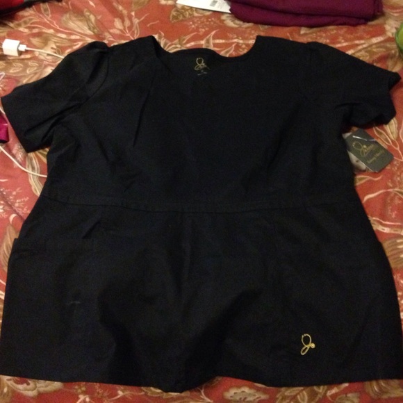 Jaanuu peplum style scrub top!