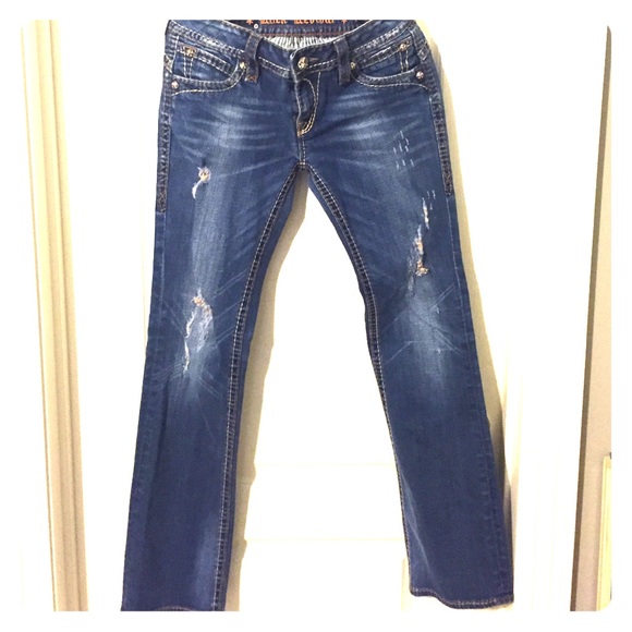Distressed rock revival jeans.