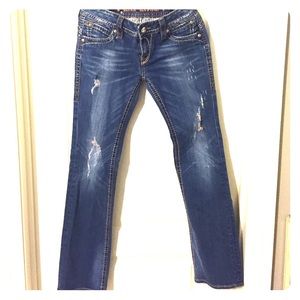 Distressed rock revival jeans.