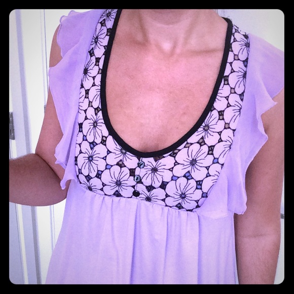 Purple top with flowy cap sleeve and floral detail