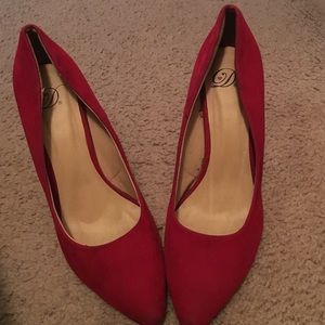 Pointed red heels