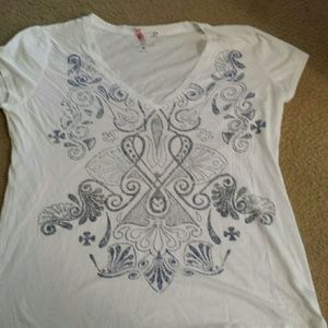 Really cute white shirt with grey blue designs.