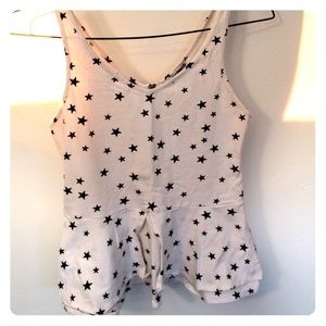 Peplum white tank with black stars.