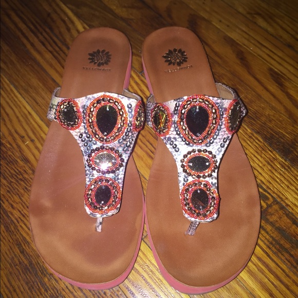 Yellow box embezzled flip flops