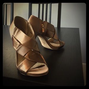 Worn-twice Michael Kors gold snakeskin pumps.