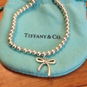 Used Tiffany's bow bracelet.
