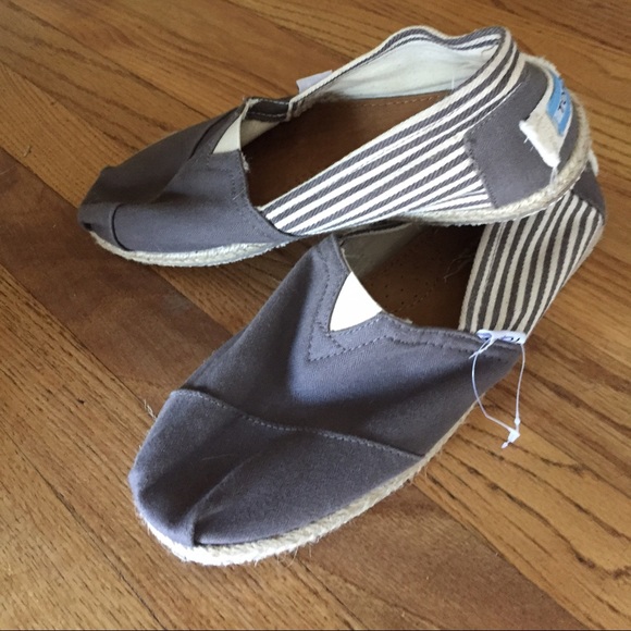 Toms grey and white striped slip ons