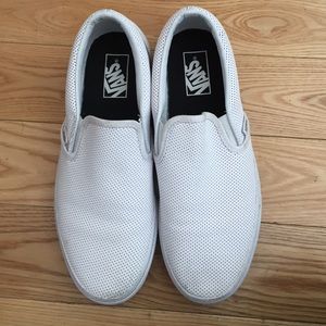Worn white leather vans