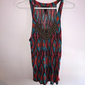 Multicolored summer top. Embellished neckline.