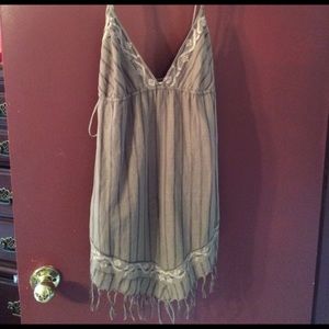 Tan cover up or top.