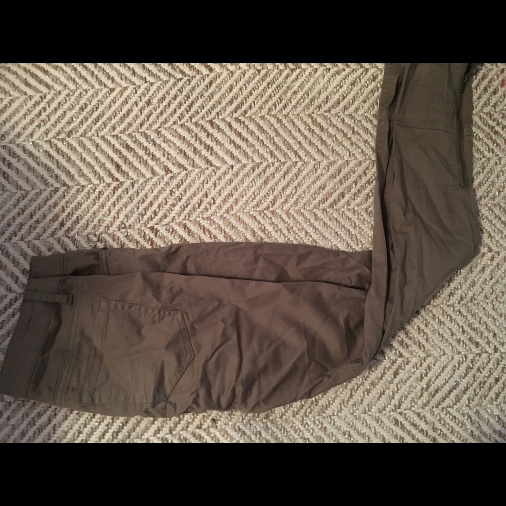 Olive colored pants with zipped ankle