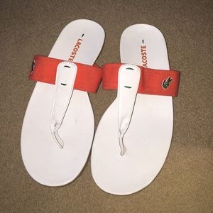 Lacoste white and orange sandal.