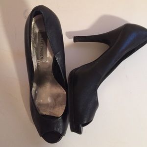 Peeptoe black leather pumps