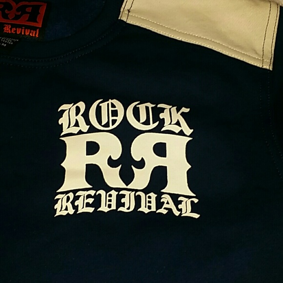 Holding **Nwt. ROCK REVIVAL SWEATSHIRT