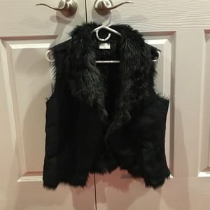 Faux fur black vest.