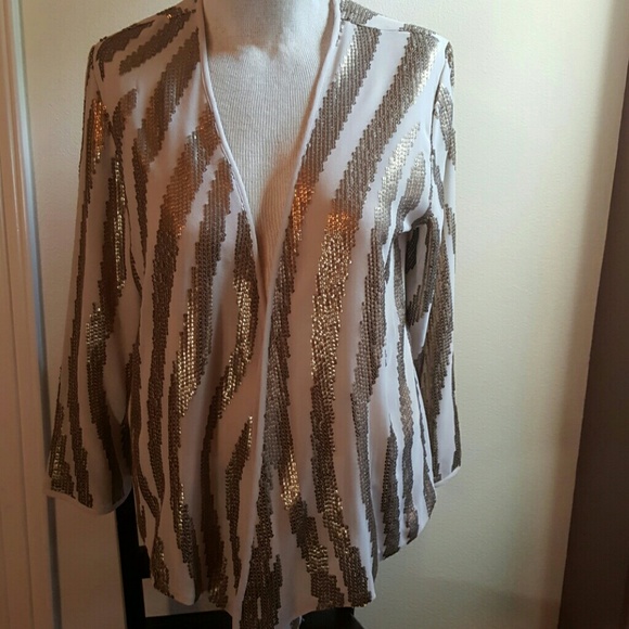 It is a light weight jacket with gold sequ?ns