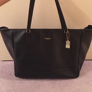 Large, leather coach bag.